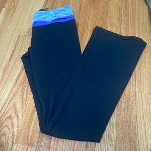 Ivivva black flare leggings with purple waist band